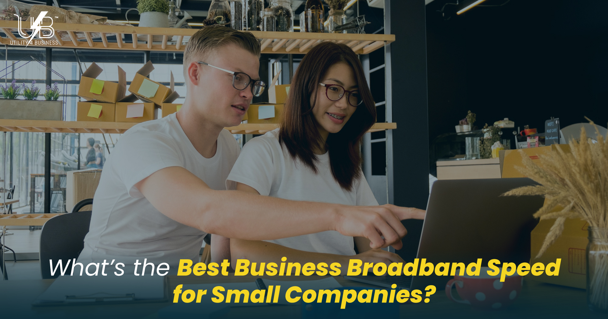 UK small business owners checking broadband options on a laptop as utility4business explains business broadband costs.